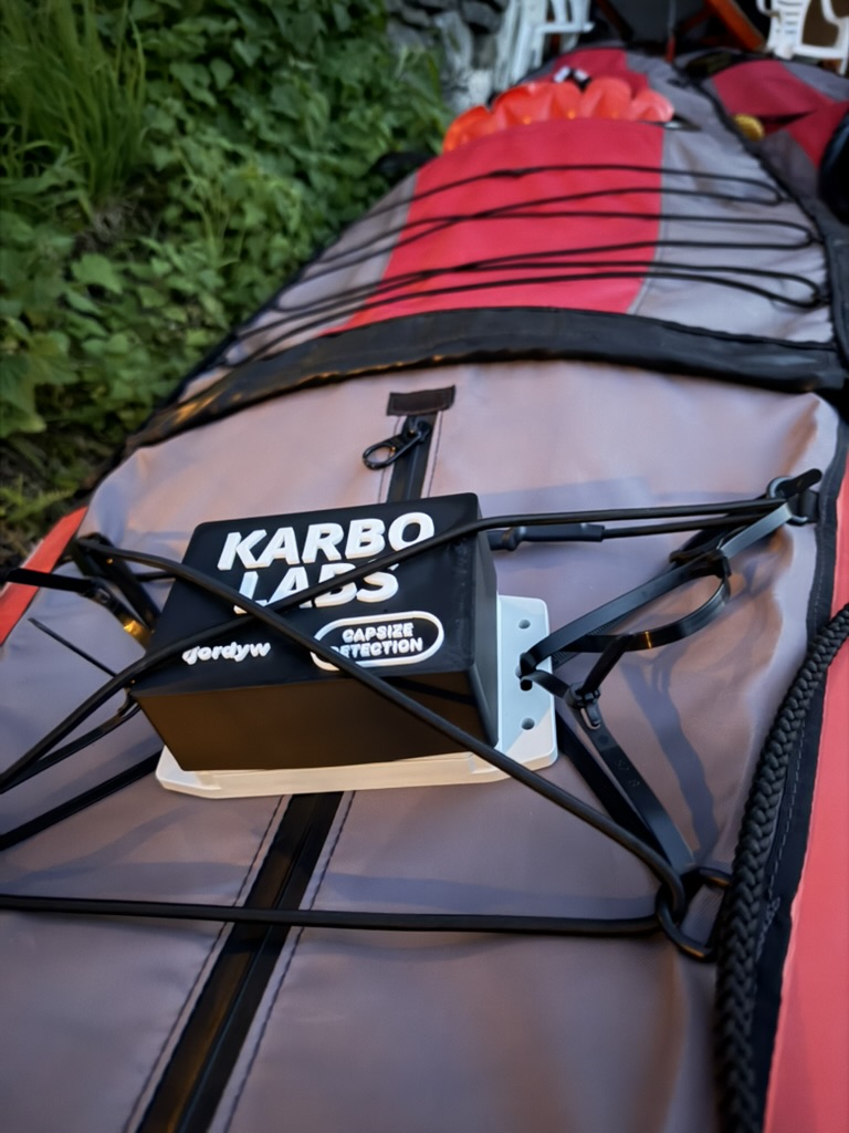 Karbo Labs tracker mounted beneath the deck rigging of a rental kayak
